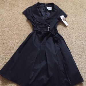 Black taffeta dress.